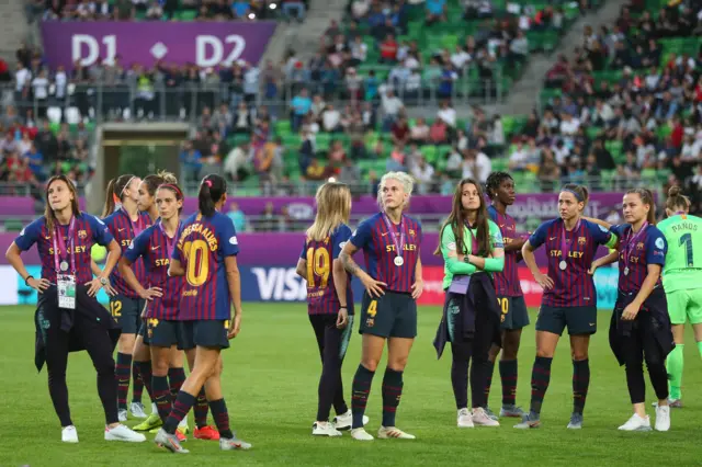 Barcelona players dejected in Budapest