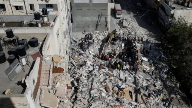 A general view as rescue workers search for victims amid rubble at the site of Israeli air strikes, in Gaza City May 16, 2021