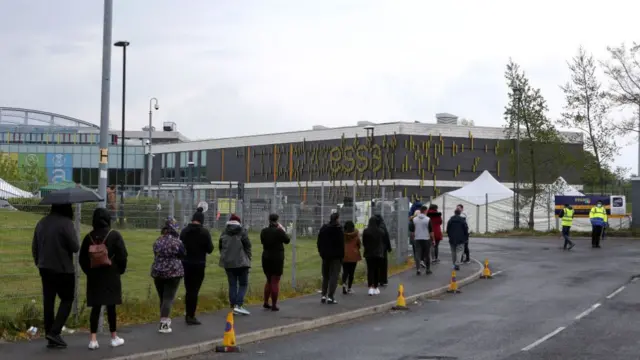 People queue for a vaccine in Bolton