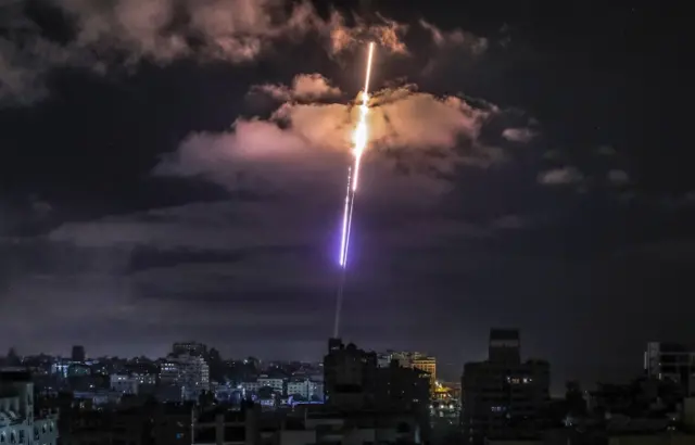 A rocket fired from Gaza flies towards Israel, in Gaza City, 17 May 2021.