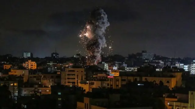 Smoke rises after an Israeli air strike hits Gaza City, 17 May 2021