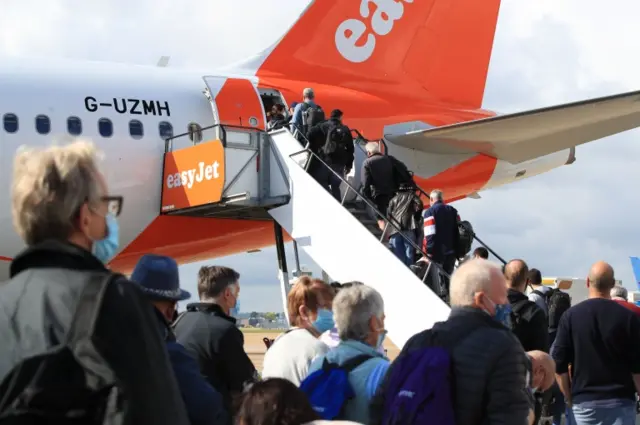 Passengers boarding a plane at Gatwick airport