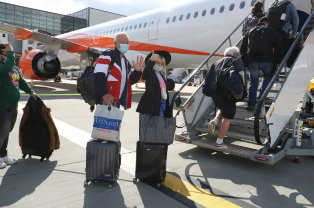 Travellers boarding a plane at Gatwick