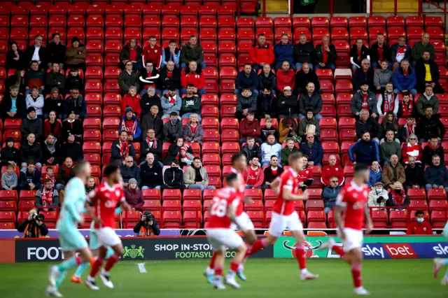 Barnsley fans watch from the stands during the Championship Playoff Semi Final against Swansea