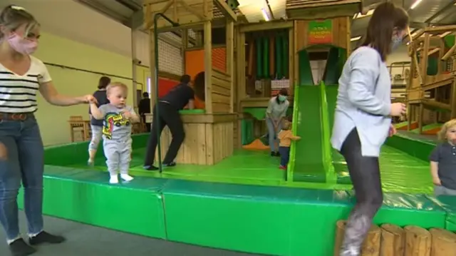 Parents and children at soft play centre