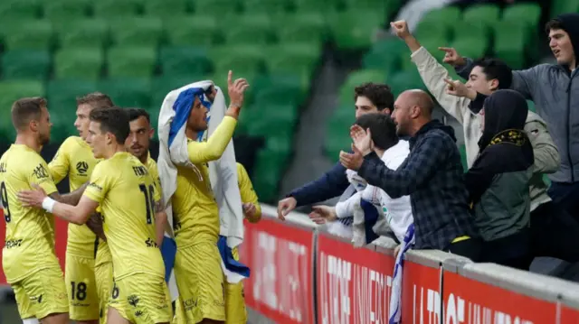 Tomer Hemed draped in Israeli flag