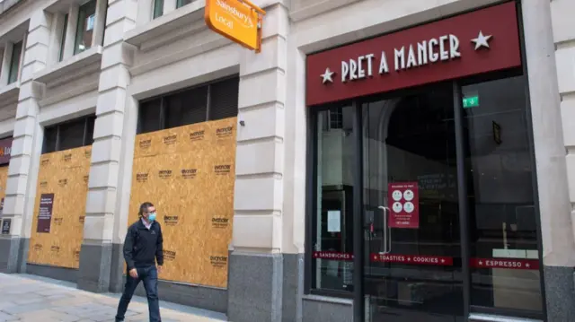 A man walks past a Pret a Manger