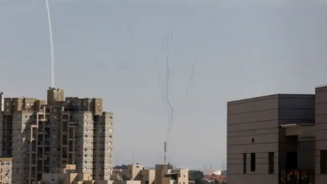 Smoke trails are seen as Israel's Iron Dome system is launched to intercept rockets from the Gaza Strip, as seen from Ashkelon, Israel (16 May 2021)