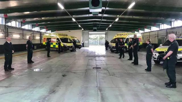 Ambulance staff standing in Ambulance hub