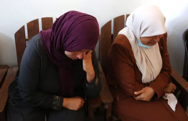 Palestinians mourn during the funeral ceremony