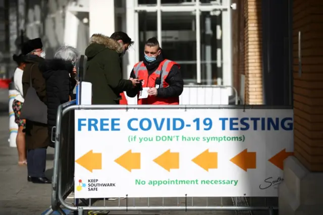 People queue outside a coronavirus test centre at London Bridge Station