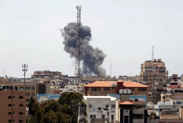 Smoke rises during an Israeli air strike in Gaza City. Photo: 19 May 2021