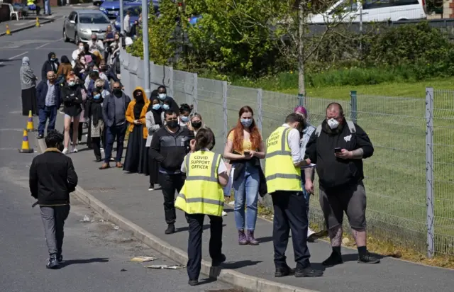 People queuing for vaccinations in Bolton