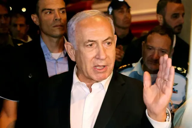 Israeli Prime Minister Benjamin Netanyahu tours the city of Lod early on May 12, 2021