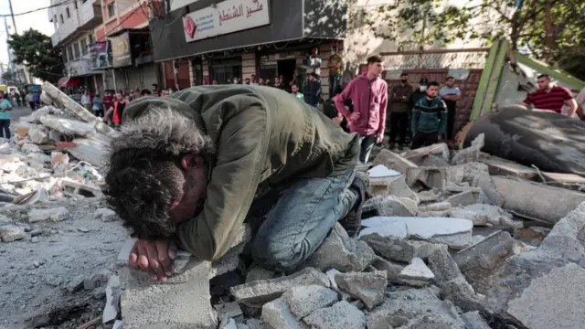 A Palestinian man cries on the rubble of his destroyed house in the Gaza Strip. Photo: 16 May 2021