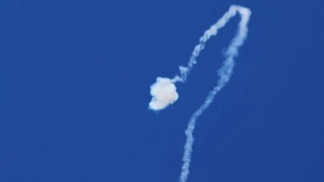 Smoke trail is seen as Israel's Iron Dome missile defence system intercepts rockets launched from the Gaza Strip (19 May 2021)