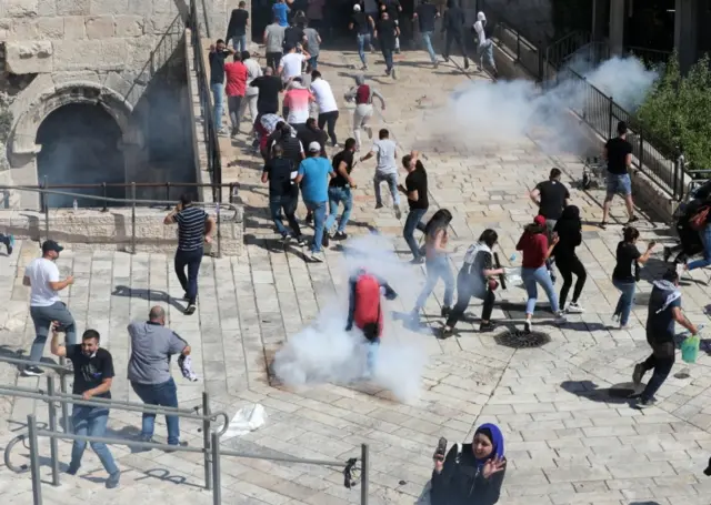 People participate during a demonstration held by Palestinians to show their solidarity amid Israel-Gaza fighting, in Jerusalem's Old City