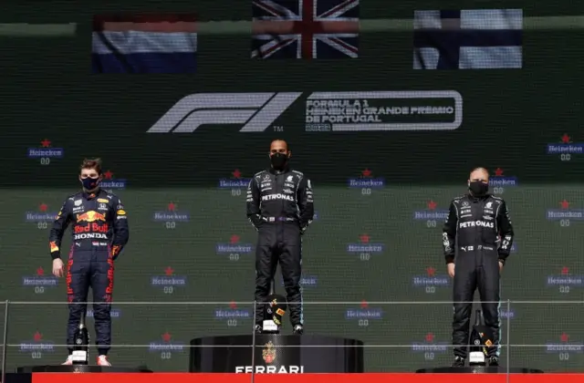 Verstappen, Hamilton and Bottas stand on the podium