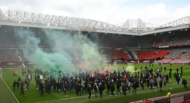 Fans on Old Trafford pitch