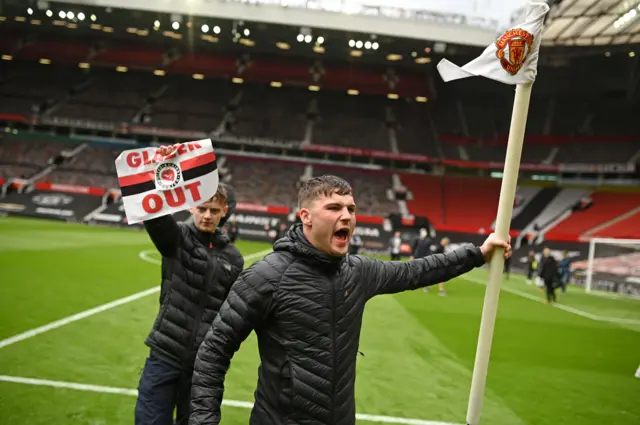 Fans on Old Trafford pitch