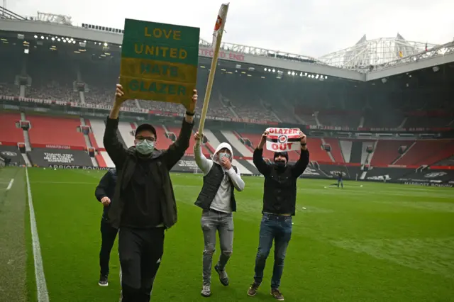 Fans on Old Trafford pitch