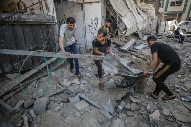 Palestinians inspect their destroyed house in Jabaliya refugee camp, northern Gaza. Photo: 20 May 2021