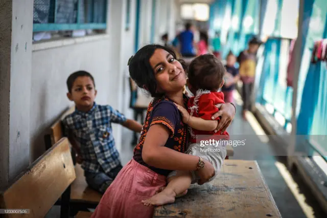 Palestinian children join their families to take refuge at the United Nations (UN) school, due to the ongoing armed conflicts in Gaza City