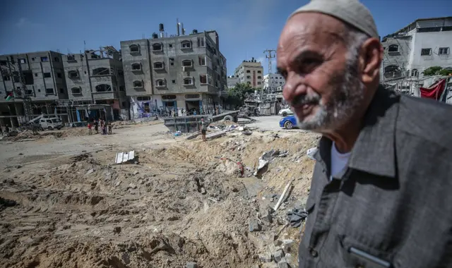 Palestinians inspect their destroyed house after Israeli air strikes in Jabaliya refugee camp northern Gaza Strip, 20 May 2021.