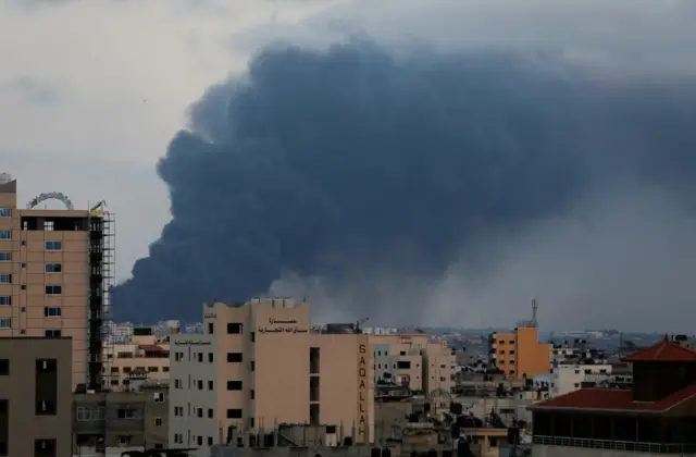 Smoke rises above buildings in Gaza