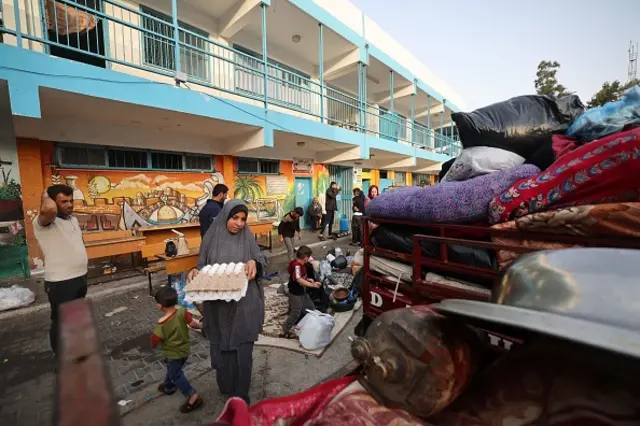 Palestinians return to her neighbourhood hit by Israeli bombardment in Gaza City, after a ceasefire brokered by Egypt between Israel and Hamas, on May 21, 2021