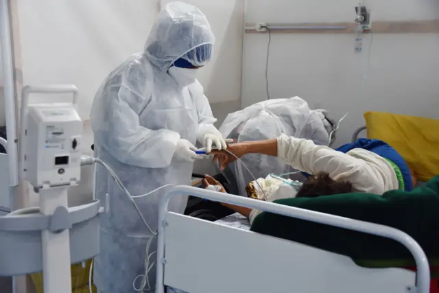 A health worker wearing Personal Protective Equipment attending to patients at the field hospital in Menzah district,, Tunisia