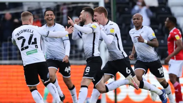 Swansea celebrate Grimes' goal