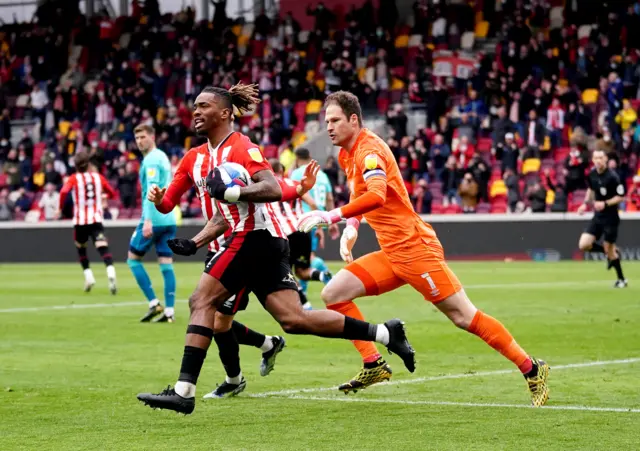 Asmir Begovic races after Ivan Toney