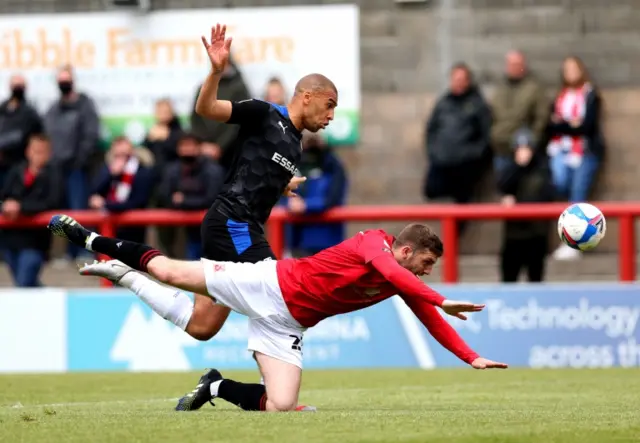 Tranmere striker James Vaughan (left) and Morecambe's Ryan Cooney battle for the ball d