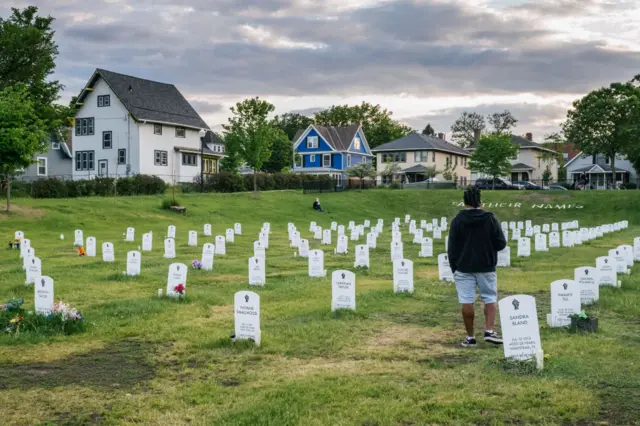 People visit the Say Their Names Cemetery at the intersection of 38th Street and Chicago Avenue on May 24, 2021 in Minneapolis, Minnesota. The community around Minneapolis continues to gather while making preparations for the one year anniversary of George Floyd's death