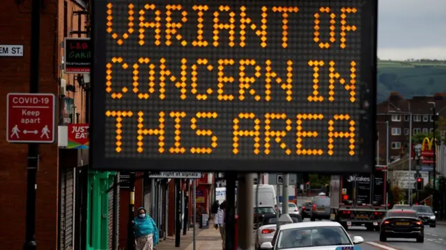 A sign saying 'variant of concern in this area'