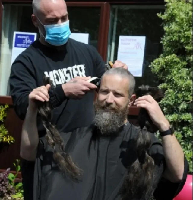 PC Richard Lymer having his haircut at charity event