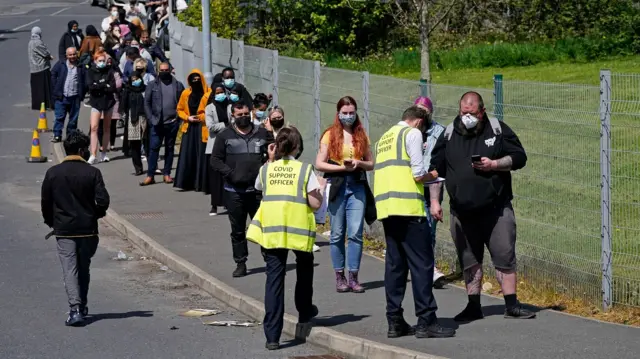 People in Bolton queuing to get a vaccine