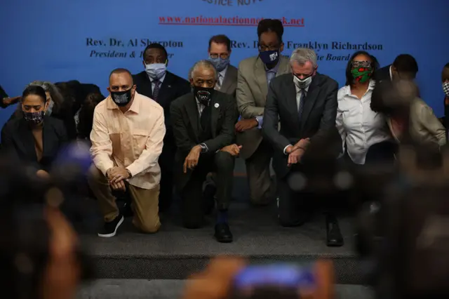 Al Sharpton and New York City Mayor Bill de Blasio deliver remarks for the one-year anniversary of George Floyd's death at the National Action Network as they kneeled for 9 minutes 29 seconds in the Harlem district of New York City, United States on May 25, 2021