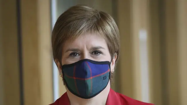 Nicola Sturgeon wearing a tartan face covering