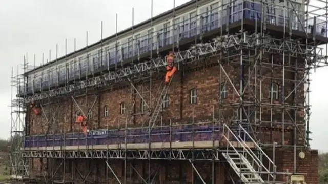 The signal box surrounded by scaffolding