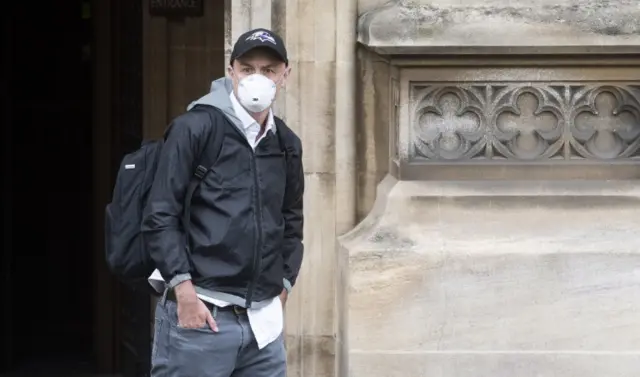 Cummings in face mask and baseball cap