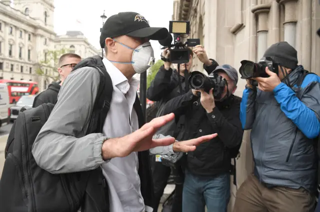 Dominic Cummings surrounded by photographers arrives at Parliament