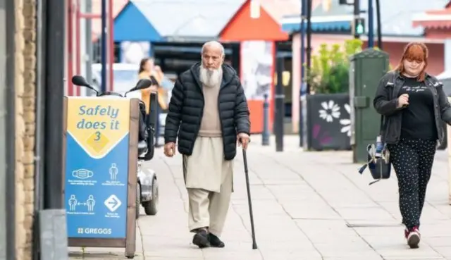 Man and woman on Dewsbury street