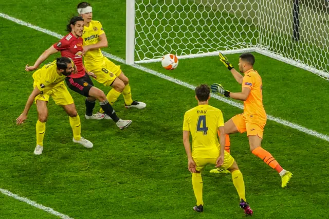 Villarreal's Argentine goalkeeper Geronimo Rulli (R) stops a shot by Manchester United's Uruguayan striker Edinson Cavani (L) during the UEFA Europa League final football match between Villarreal and Manchester United at the Gdansk Stadium in Gdansk