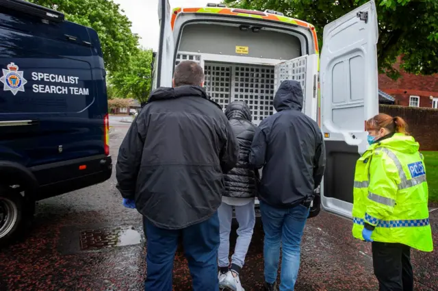 Suspect is put in the back of a police van in Gateshead