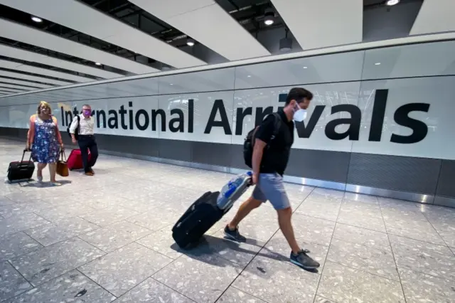 Passengers at Heathrow Airport in London