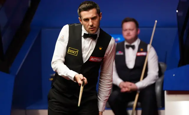 Selby considers the angles of his next shot