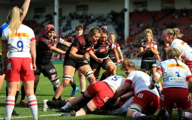 Sophie de Goede of Saracens celebrates as team mate Marlie Packer goes over