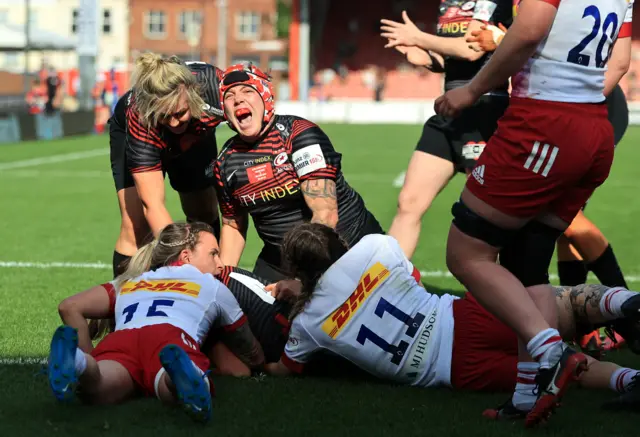 Donna Rose of Saracens celebrates as team mate Sophie de Goede scores